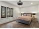 A serene bedroom featuring hardwood floors and a comfortable bed at 4495 Utica St, Denver, CO 80212