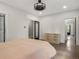 Bright bedroom featuring hardwood floors, neutral paint and updated fixtures at 4495 Utica St, Denver, CO 80212