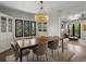 Elegant dining room featuring a decorative chandelier and hardwood floors at 4495 Utica St, Denver, CO 80212