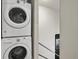 Convenient laundry area featuring a stacked washer and dryer at 4495 Utica St, Denver, CO 80212