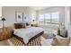 Bright bedroom featuring a large window, and seating area at 119 Leafy Aster Ln, Castle Rock, CO 80104