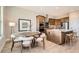 Modern kitchen and dining area featuring stainless steel appliances and a center island at 119 Leafy Aster Ln, Castle Rock, CO 80104