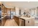 Modern kitchen featuring stainless steel appliances and a large center island at 119 Leafy Aster Ln, Castle Rock, CO 80104