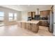 Modern kitchen featuring stainless steel appliances and a center island with seating at 119 Leafy Aster Ln, Castle Rock, CO 80104