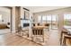 Bright living room with fireplace, stylish seating, and a door to the outdoor area at 119 Leafy Aster Ln, Castle Rock, CO 80104
