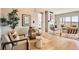 Bright living room featuring modern chairs, area rug, and lots of natural light at 119 Leafy Aster Ln, Castle Rock, CO 80104