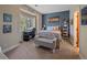 Cozy bedroom with a computer desk by the window and decorated with wall art at 2817 Keystone Dr, Evergreen, CO 80439
