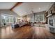 Spacious bedroom with a stone fireplace and a window bench at 2817 Keystone Dr, Evergreen, CO 80439