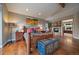 Warm bedroom featuring a stone fireplace, vaulted ceiling and an ensuite bathroom at 2817 Keystone Dr, Evergreen, CO 80439