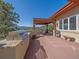Outdoor deck offers scenic views and a built-in grill, bench, and covered dining area at 2817 Keystone Dr, Evergreen, CO 80439