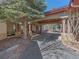 Home exterior showing stone and wood detail under a covered entryway and driveway at 2817 Keystone Dr, Evergreen, CO 80439