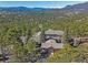 Stunning home exterior with mountain views surrounded by lush trees for a private feel at 2817 Keystone Dr, Evergreen, CO 80439
