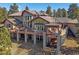 Spacious home with multiple decks and outdoor seating areas, perfect for entertaining at 2817 Keystone Dr, Evergreen, CO 80439