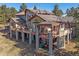 Beautiful home featuring a large deck with multiple seating areas and a gazebo, ideal for outdoor living at 2817 Keystone Dr, Evergreen, CO 80439