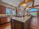 Spacious kitchen with custom cabinets, granite countertops, and stainless steel appliances at 2817 Keystone Dr, Evergreen, CO 80439