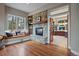 Cozy living room showcasing a stone fireplace with adjoining window bench at 2817 Keystone Dr, Evergreen, CO 80439