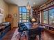 Well-lit home office featuring built-in bookshelves and a large window with scenic views at 2817 Keystone Dr, Evergreen, CO 80439