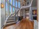 Sweeping staircase with large windows providing ample natural light and scenic views at 2817 Keystone Dr, Evergreen, CO 80439