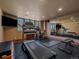 Bright workout room with hardwood floors, a treadmill, stationary bike, and large mirror at 2817 Keystone Dr, Evergreen, CO 80439