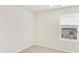 Bedroom featuring neutral carpet and a window offering neighborhood views at 1918 S Coolidge Way, Aurora, CO 80018