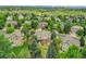 Aerial view of the property within a community and beautiful mountain views at 8646 Fawnwood Dr, Castle Pines, CO 80108