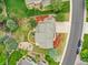 Bird's eye view of the landscaped yard with patio, well-maintained garden, and a driveway at 8646 Fawnwood Dr, Castle Pines, CO 80108