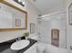 Well-lit bathroom features a granite countertop and shower at 8646 Fawnwood Dr, Castle Pines, CO 80108