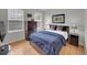 Cozy bedroom with natural light, dresser, and wood furnishings at 8646 Fawnwood Dr, Castle Pines, CO 80108