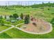 Aerial view of a playground area with slides and picnic tables on a grassy hill at 8646 Fawnwood Dr, Castle Pines, CO 80108