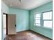Cozy bedroom featuring hardwood floors and two bright windows at 1445 Saint Paul St, Denver, CO 80206