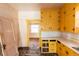 Outdated kitchen featuring yellow cabinets and stainless steel sink at 1445 Saint Paul St, Denver, CO 80206