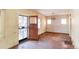 Living room with hardwood floors, an open door and vintage chandelier at 1445 Saint Paul St, Denver, CO 80206