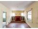 Bright room features a fireplace, built-in cabinets, and vintage window at 1445 Saint Paul St, Denver, CO 80206