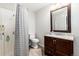 Bathroom with shower, neutral walls, and vanity at 302 Texas Dr, Idaho Springs, CO 80452