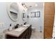 This bathroom features double sinks, granite countertops and tile flooring at 302 Texas Dr, Idaho Springs, CO 80452