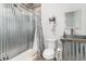 Rustic bathroom featuring metal shower, galvanized vanity and toilet, offering a unique style at 302 Texas Dr, Idaho Springs, CO 80452