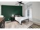 This well lit bedroom offers a full bed, dresser, side table, and large windows at 302 Texas Dr, Idaho Springs, CO 80452