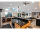 Modern kitchen with breakfast bar and scenic views from the adjacent dining area at 302 Texas Dr, Idaho Springs, CO 80452