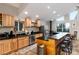 Eat-in kitchen with granite counters, wooden cabinets, and stainless steel appliances at 302 Texas Dr, Idaho Springs, CO 80452