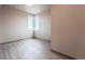 Bright bedroom with large window and neutral wall colors at 12983 W Ida Ave # 300, Littleton, CO 80127