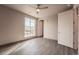 Bedroom with large window and ceiling fan at 12983 W Ida Ave # 300, Littleton, CO 80127