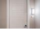 Private entrance with modern white door and keyless entry at 12983 W Ida Ave # 300, Littleton, CO 80127