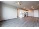 Open living room with modern flooring and kitchen view at 12983 W Ida Ave # 300, Littleton, CO 80127