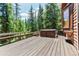 Deck with hot tub and wooded views; perfect for relaxing at 531 Mountain View Trl, Breckenridge, CO 80424