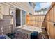 This back patio features an entrance to the house with a sliding glass door and a wooden fence at 8975 Field St # 39, Broomfield, CO 80021
