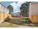 This is the large fenced backyard with a grassy lawn and a playground at the back at 8975 Field St # 39, Broomfield, CO 80021