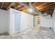 Unfinished basement with exposed duct work and concrete flooring at 8975 Field St # 39, Broomfield, CO 80021