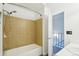 Tile surround with shower and neutral decor in this bathroom at 8975 Field St # 39, Broomfield, CO 80021
