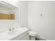 Clean bathroom with white fixtures and shower with tile surround at 8975 Field St # 39, Broomfield, CO 80021