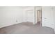 This bedroom offers neutral carpeting and an open closet at 8975 Field St # 39, Broomfield, CO 80021